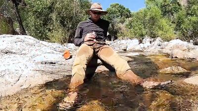 Horny dude goes to a creek in nature to jerk off