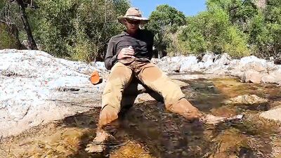 Horny dude goes to a creek in nature to jerk off