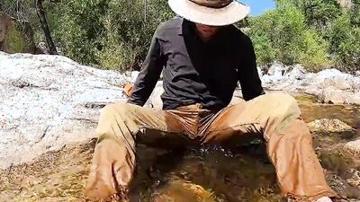 Horny dude goes to a creek in nature to jerk off