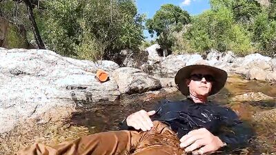 Horny dude goes to a creek in nature to jerk off