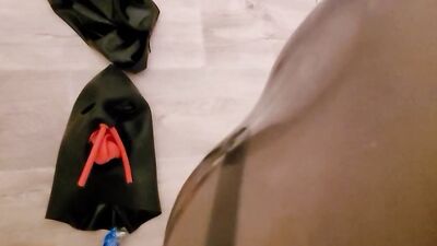 Naughty dude in a mask and latex enjoys self bondage