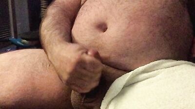 Chubby and hairy amateur films himself stroking his cock solo