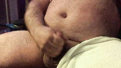 Chubby and hairy amateur films himself stroking his cock solo
