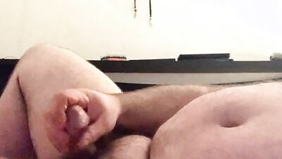 Chubby and hairy amateur films himself stroking his cock solo