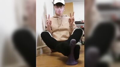Adorable Asian twink in sexy socks uses a dildo on his ass