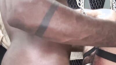 Bald hunk chokes on a big black dick before being anal rammed