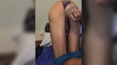 Kinky dude bends over and shoves a huge dildo in his ass