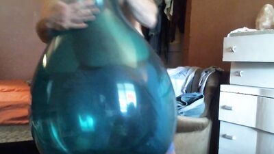 Chubby amateur with a mask blows a balloon up and fucks it
