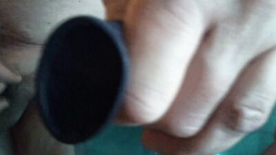 Chubby amateur with a mask blows a balloon up and fucks it