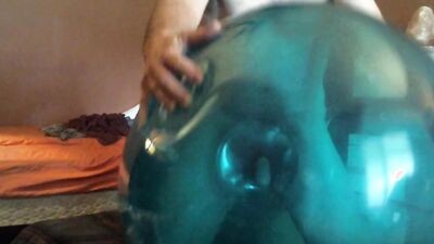 Chubby amateur with a mask blows a balloon up and fucks it