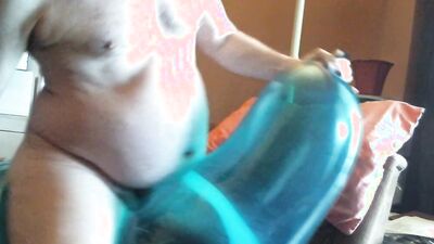 Chubby amateur with a mask blows a balloon up and fucks it
