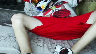Naughty biker with a helmet on tugs on his cock