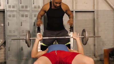 Sporty white stud lifts weights in the gym before a hunk fucks him