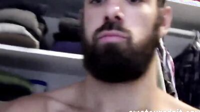 Handsome and bearded stud oils his fit body up and fucks a fleshlight