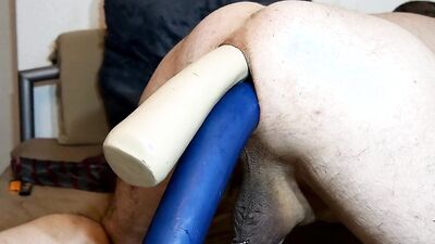 Perverted dude loves stuffing huge insertions in his stretched asshole