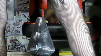 Perverted crossdresser stretches his ass by riding a big anal plug