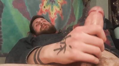 Bearded guy with a fat dick jerks it off solo