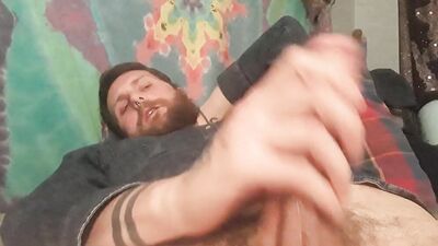 Bearded guy with a fat dick jerks it off solo