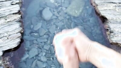 Hung dude goes outside to film himself jerking off in nature