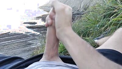 Hung dude goes outside to film himself jerking off in nature