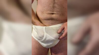 Mature guy pulls his dick out to play with it