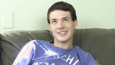 Cute twink has fun at an interview before stripping and jerking off