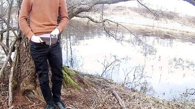 Skinny gay chap is jerking his phallus on a tree