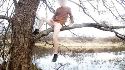 Skinny gay chap is jerking his phallus on a tree