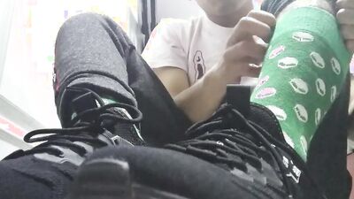 Long green socks and sweaty feet in your face