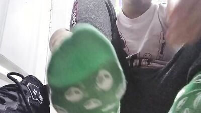 Long green socks and sweaty feet in your face