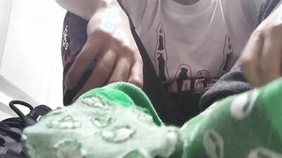 Long green socks and sweaty feet in your face