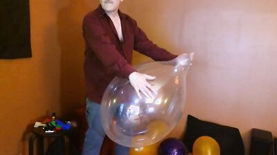 Amateur grandpa is playing with a balloon in his solo performance