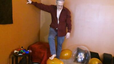 Amateur grandpa is playing with a balloon in his solo performance
