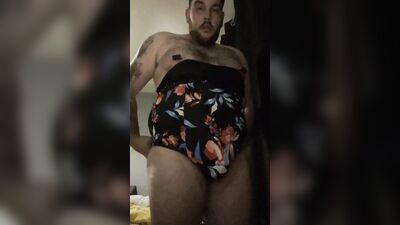 Chubby dude is posing naked in front of the camera