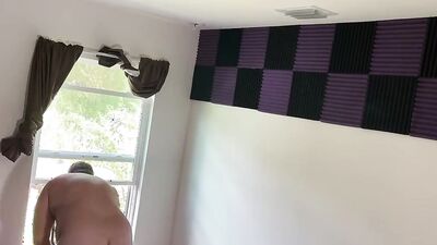 Fat guy films himself naked putting sound insulation in a room