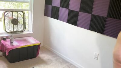 Fat guy films himself naked putting sound insulation in a room