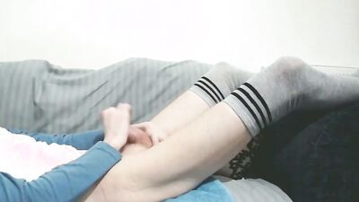 Sammy Andrews moaning and getting a huge cumshot in panties and thigh high socks while fingering ass.