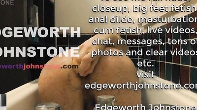 Perverted guy anal rides a huge dildo in a bathtub
