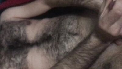 Amateur bear is stroking his dick in front of the camera
