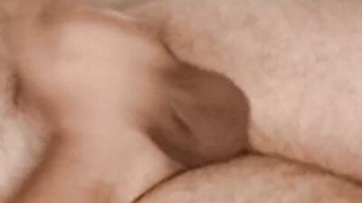 Chubby and hairy amateur relaxes while lying down and jerks off