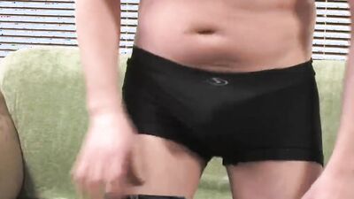 Amateur gay bloke is stroking his pecker on the couch