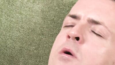 Amateur gay bloke is stroking his pecker on the couch