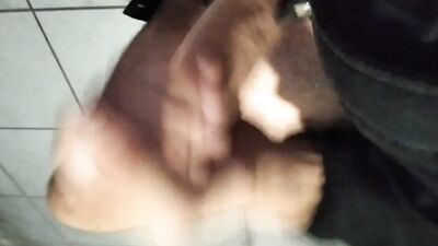 Horny dude is jerking his big dick inside the toilet