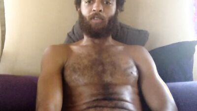Cute and hairy guy with a sexy beard jerks off solo