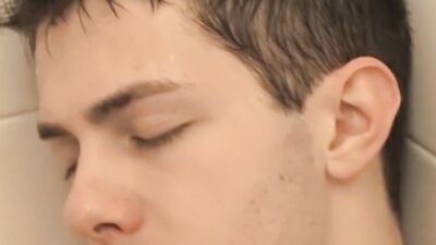 Twink Keith Conner gets horny under the shower and masturbates