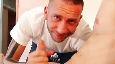 Naughty guy flirts with the camera while having a dick in his mouth