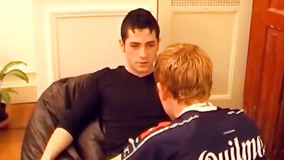 Gay twinks are kissing and making out on that couch