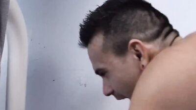 Two dudes are barebacking after a hard training in the gym