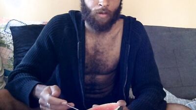 Hairy guy eats a watermelon wearing nothing but sexy robes