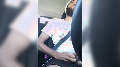 Rock Mercury plays with his big dick inside the car